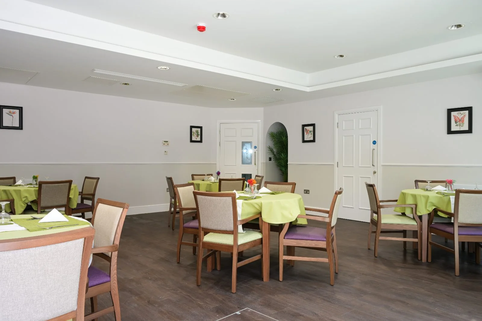 Dining room with green tablecloths